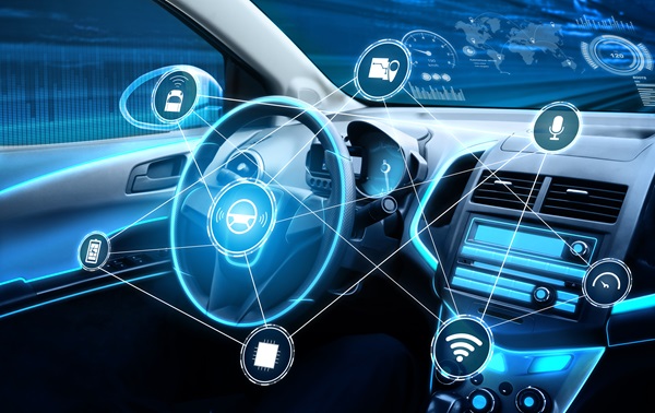 Futuristic interior of a driverless car with digital icons representing autonomous features such as GPS, voice control, wireless connectivity, and security.